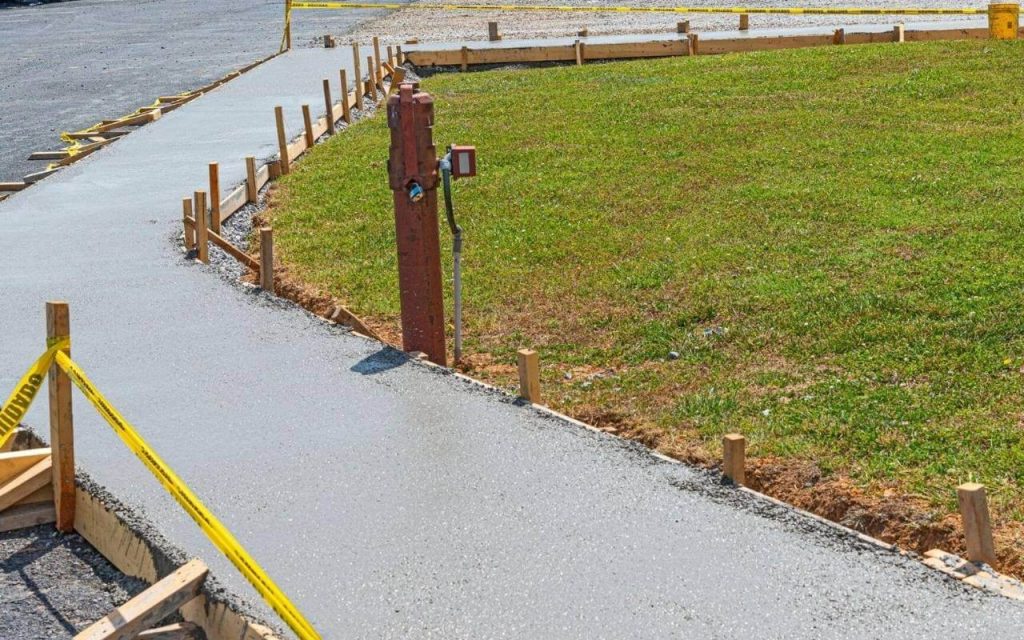 FLLA Concrete Contractor Lehigh Acres's Staff working on a Concrete Sidewalk project in Lehigh Acres FL